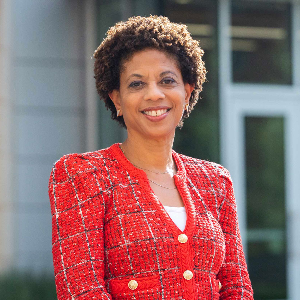 Melody Barnes standing in front of the Karsh Institute of Democracy