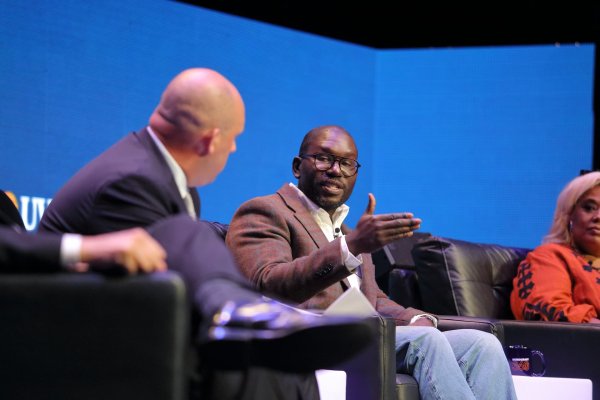 Three panelists having a conversation on stage at D360