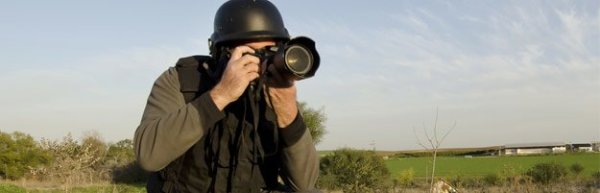 Helmeted photojournalist