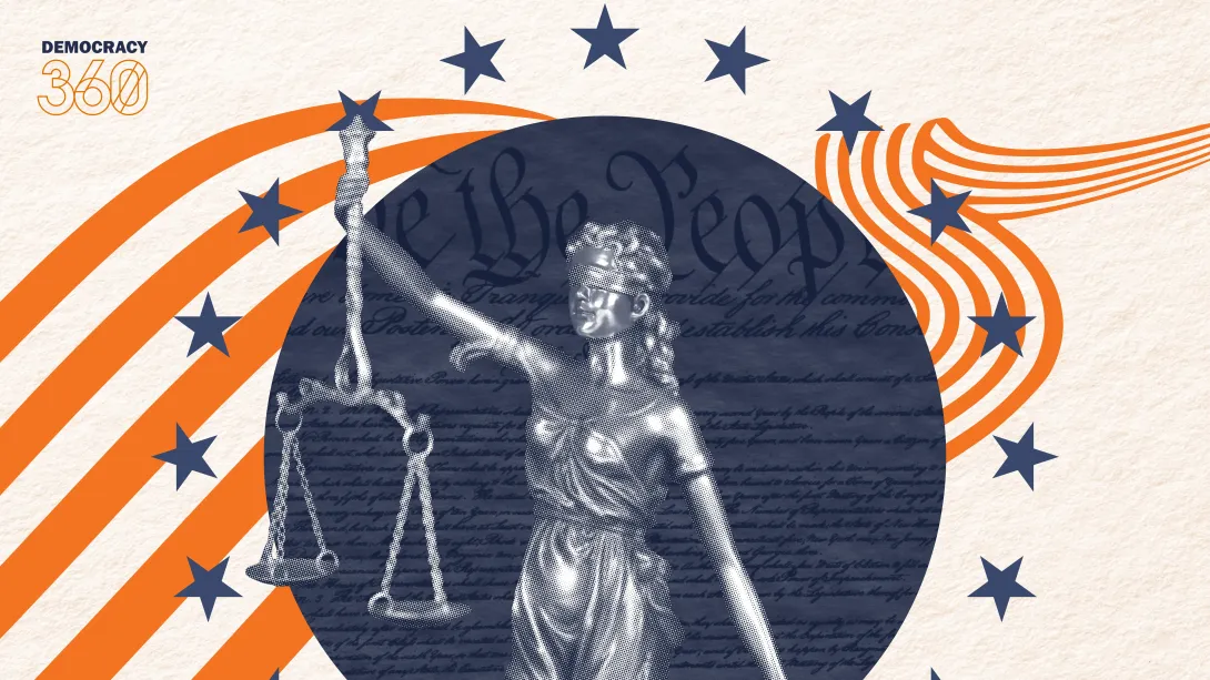 Lady Justice stands in front of the United States Constitution, surrounded by a ring of stars.