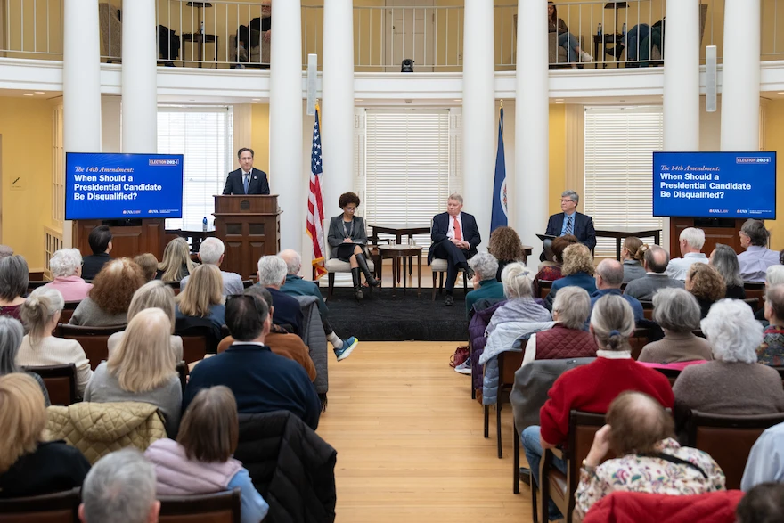 A large room of attendees at the election event