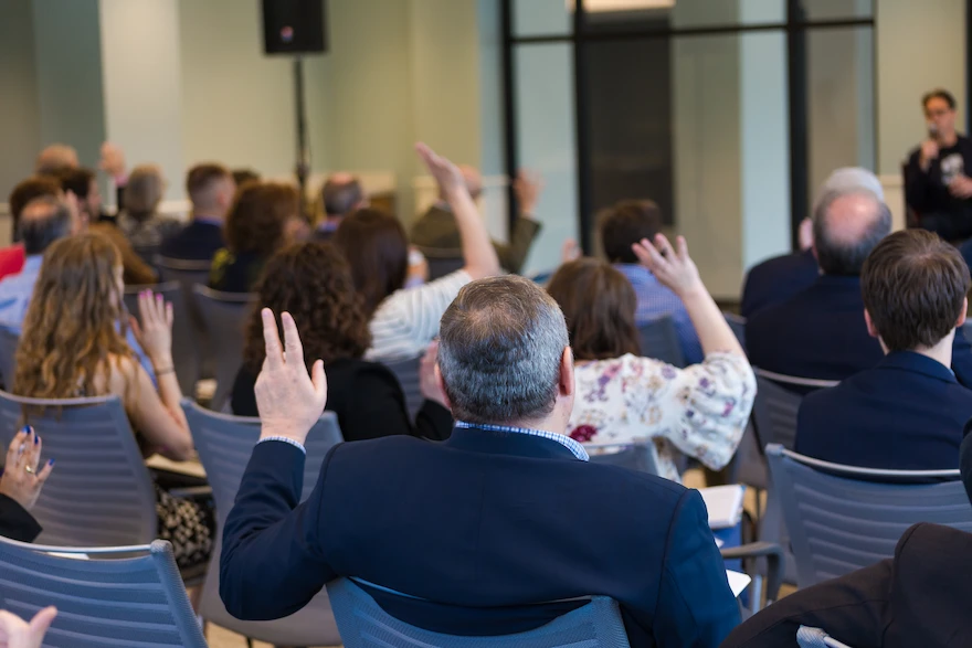 Hands raised at an event